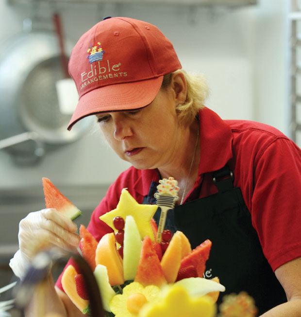 Kellie McLendon making an Edible Arrangement